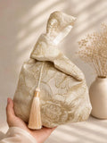 Japanese knot gold bag with a tassel