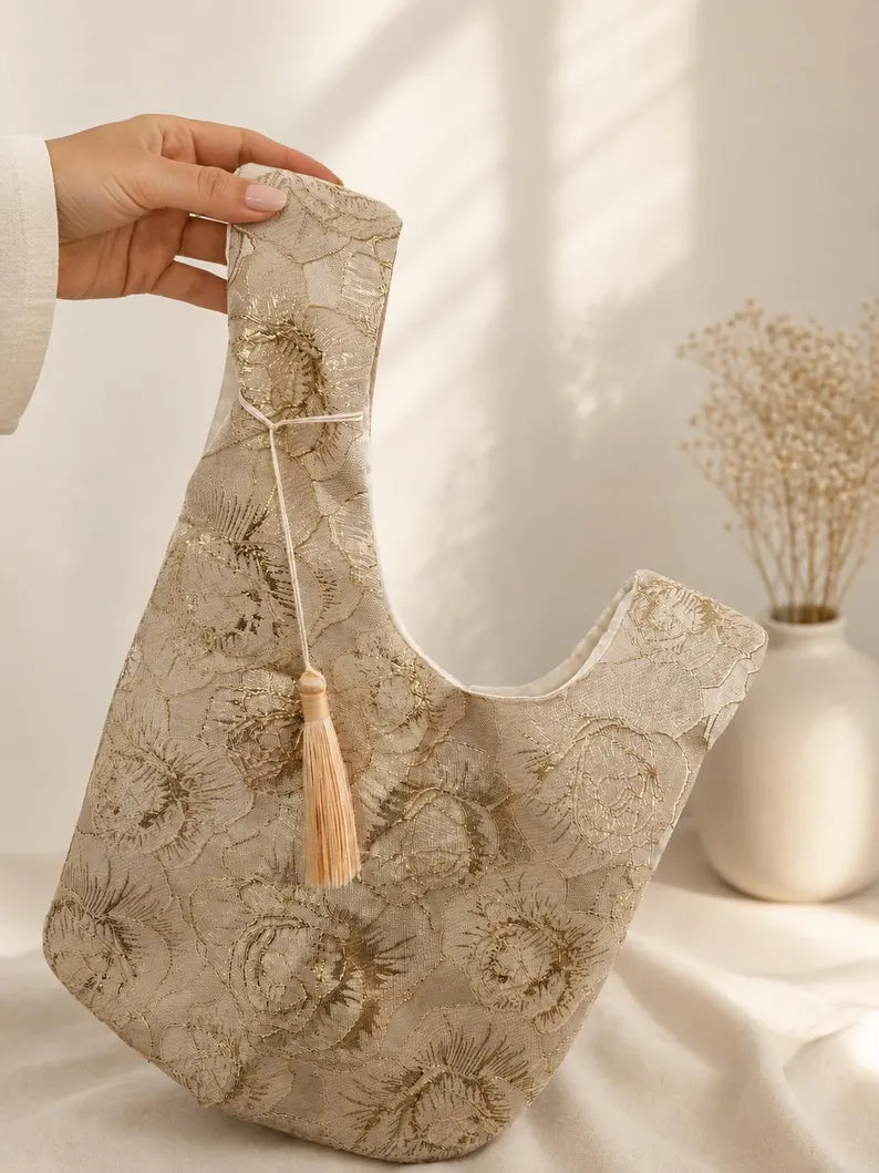 Japanese knot gold bag with a tassel