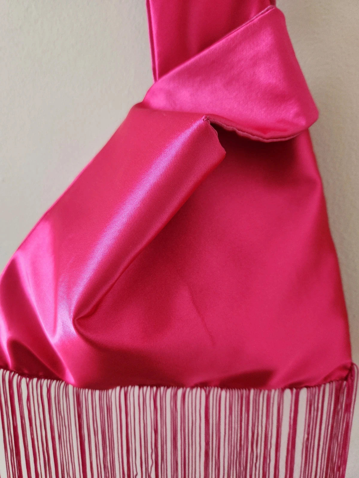 Japanese knot wrist bag in hot pink