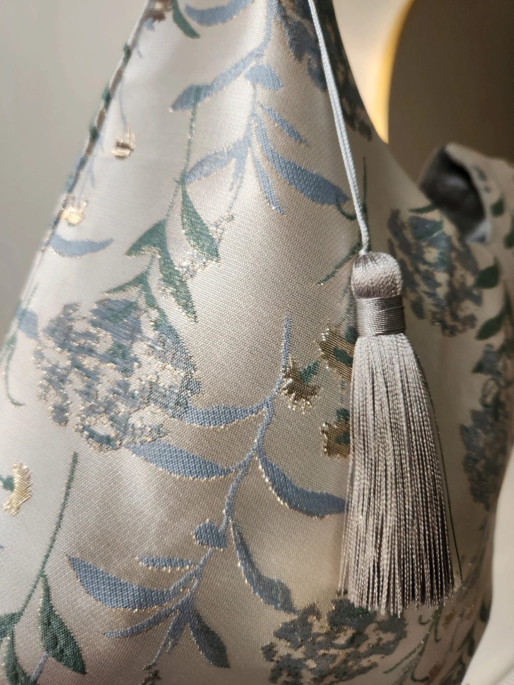 Japanese knot wrist bag with a tassel and a fringe trim