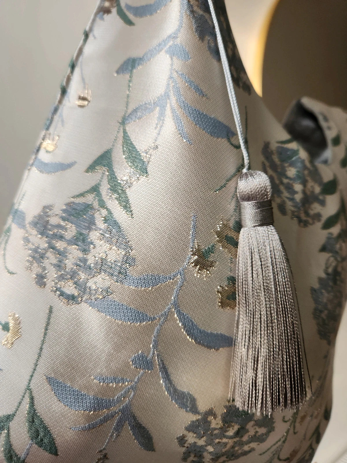 Japanese knot wrist bag with a tassel and a fringe trim
