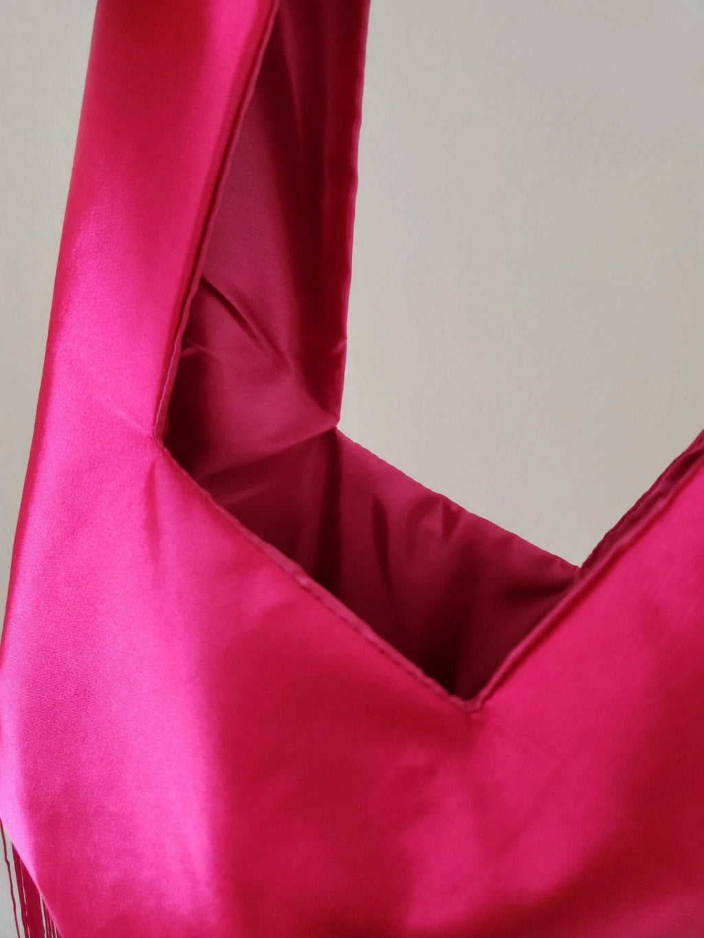 Japanese knot wrist bag in hot pink