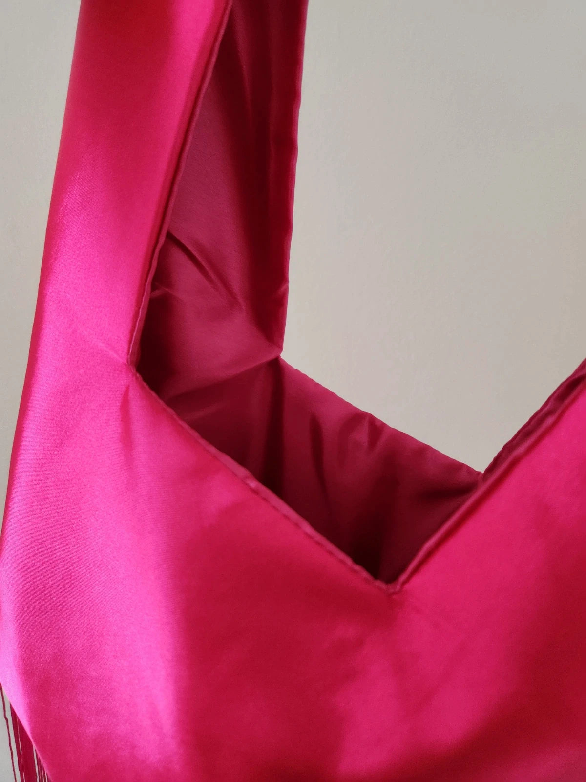 Japanese knot wrist bag in hot pink