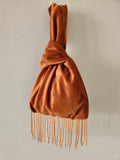 Japanese knot wrist bag with a beaded fringe trim