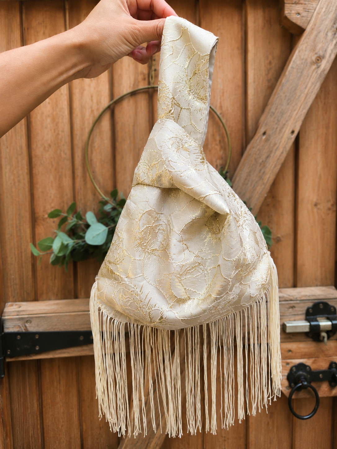 Japanese knot gold bag with a fringe