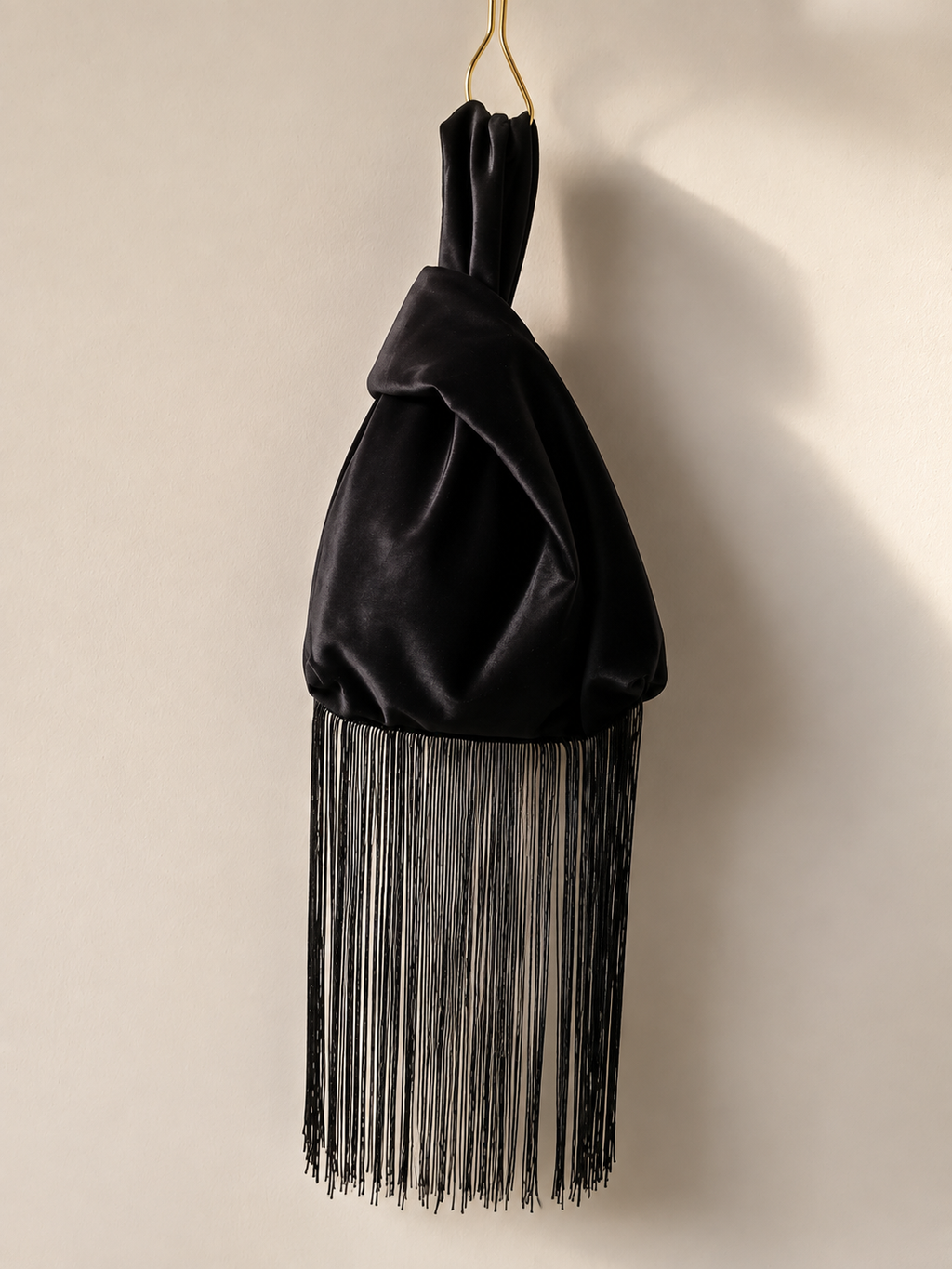 Japanese knot 'Medusa' black velvet bag with a fringe trim
