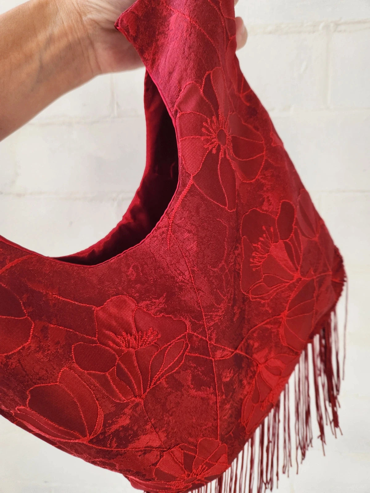 Japanese knot bag with a tassel fringe trim in red
