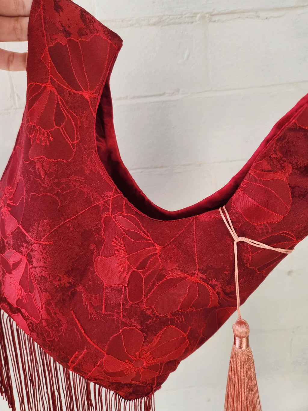 Japanese knot bag with a tassel fringe trim in red