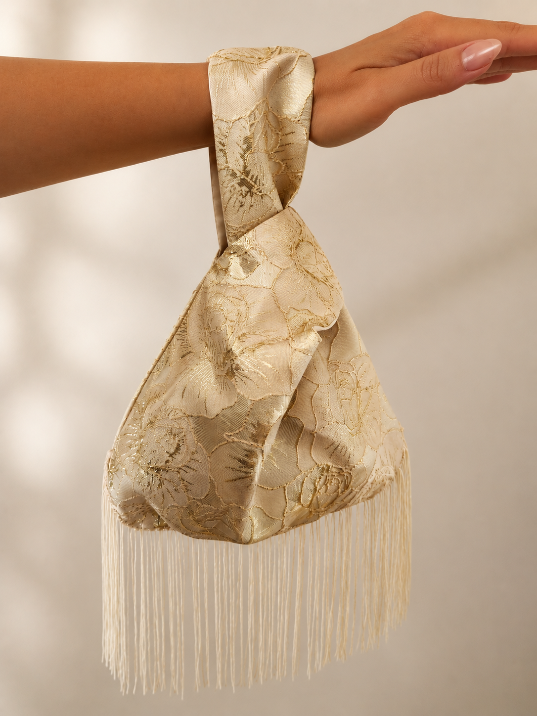 Japanese knot gold bag with a fringe