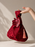 Japanese knot wrist bag with an orchid