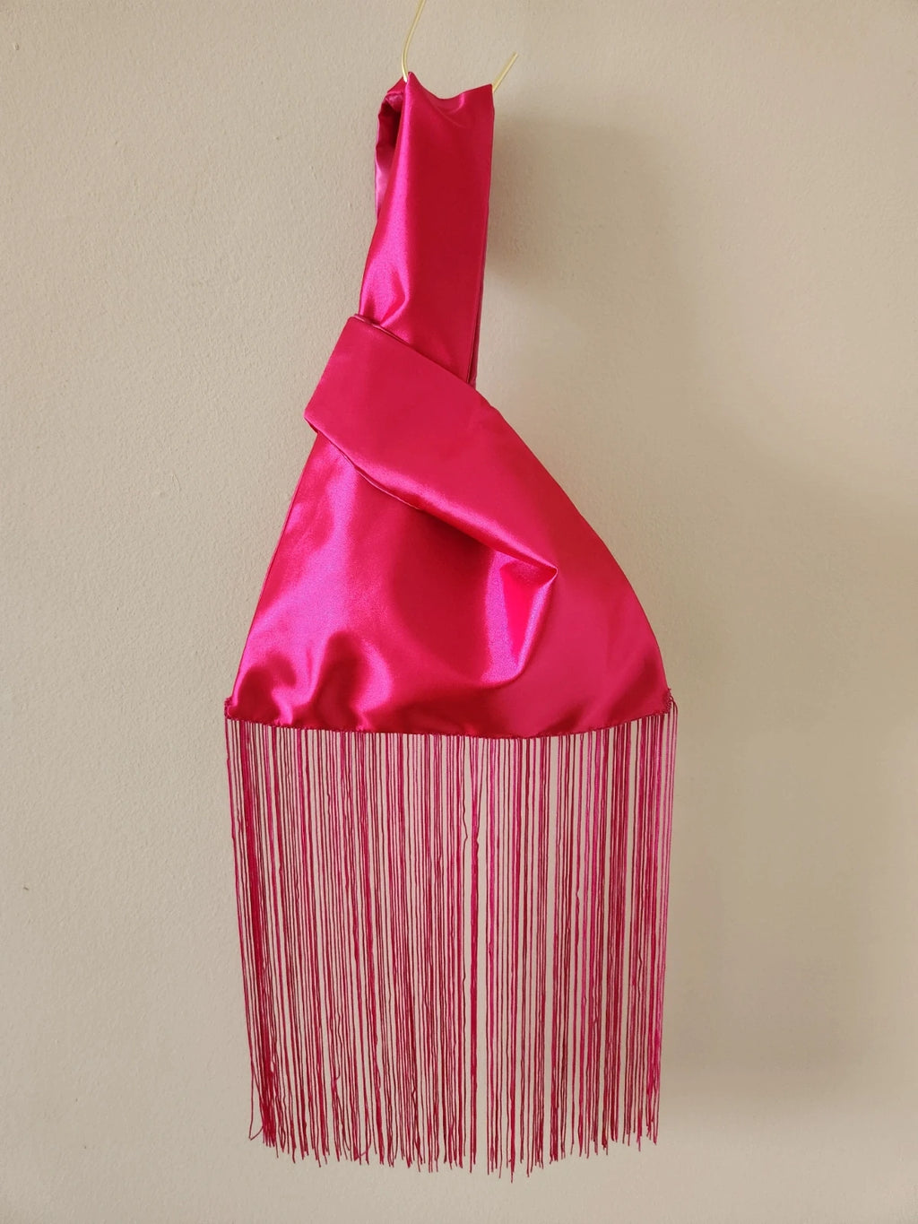 Japanese knot wrist bag in hot pink