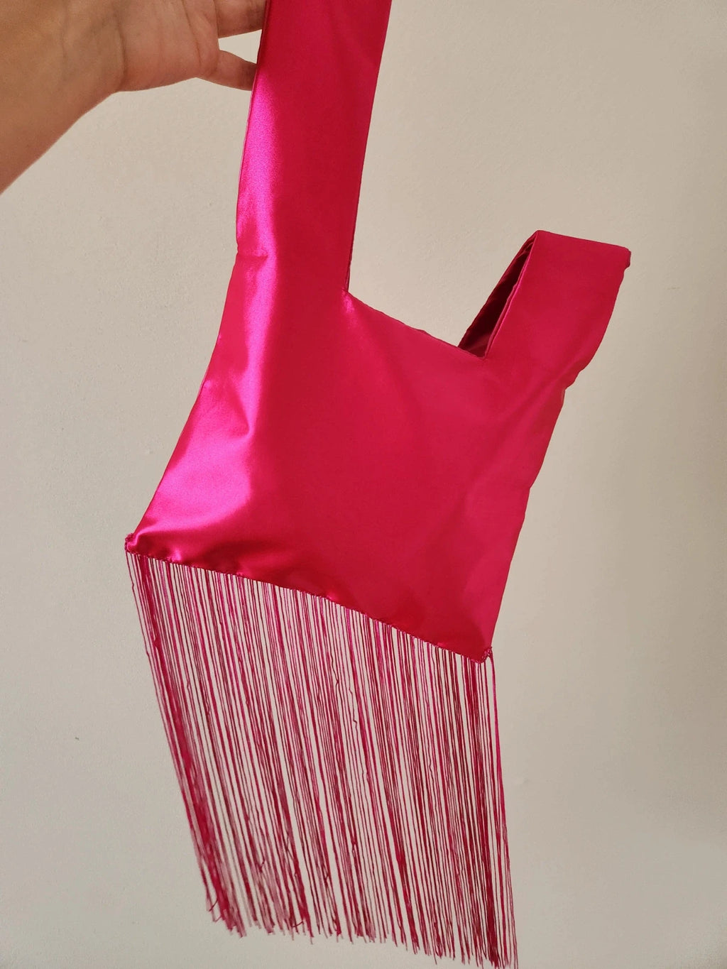 Japanese knot wrist bag in hot pink