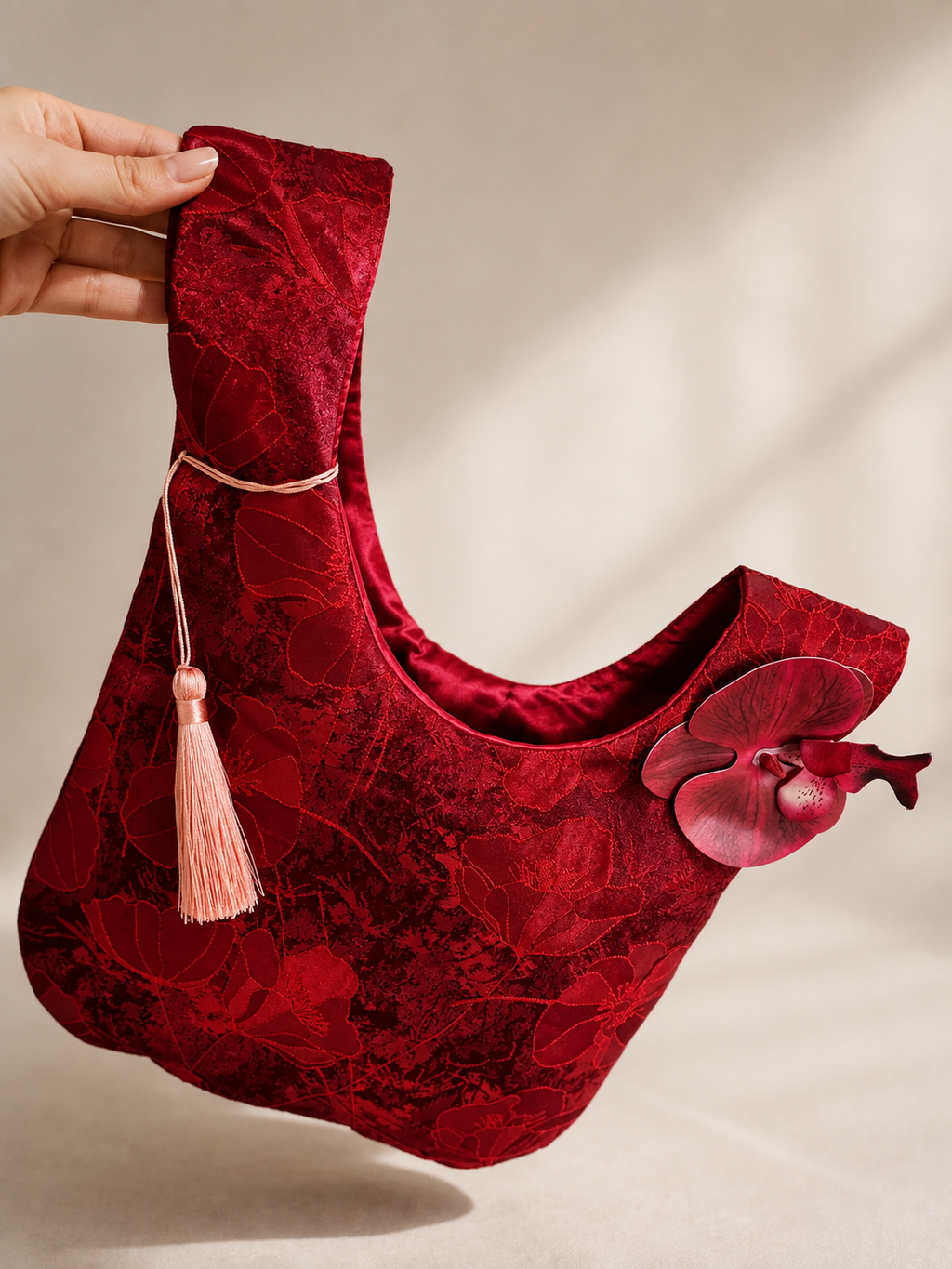 Japanese knot wrist bag with an orchid