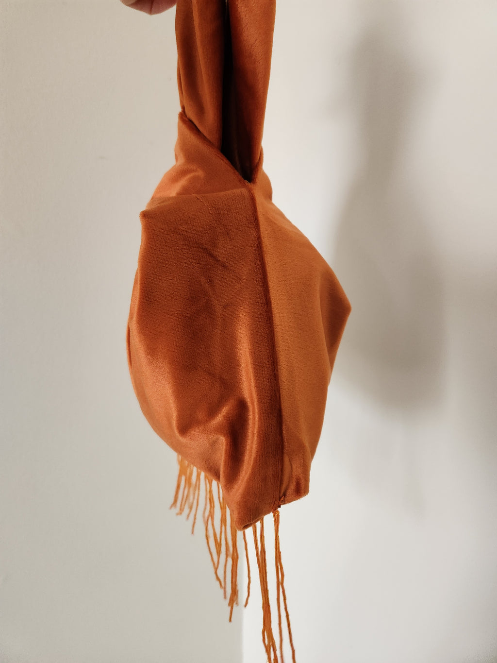 Japanese knot wrist bag with a beaded fringe trim
