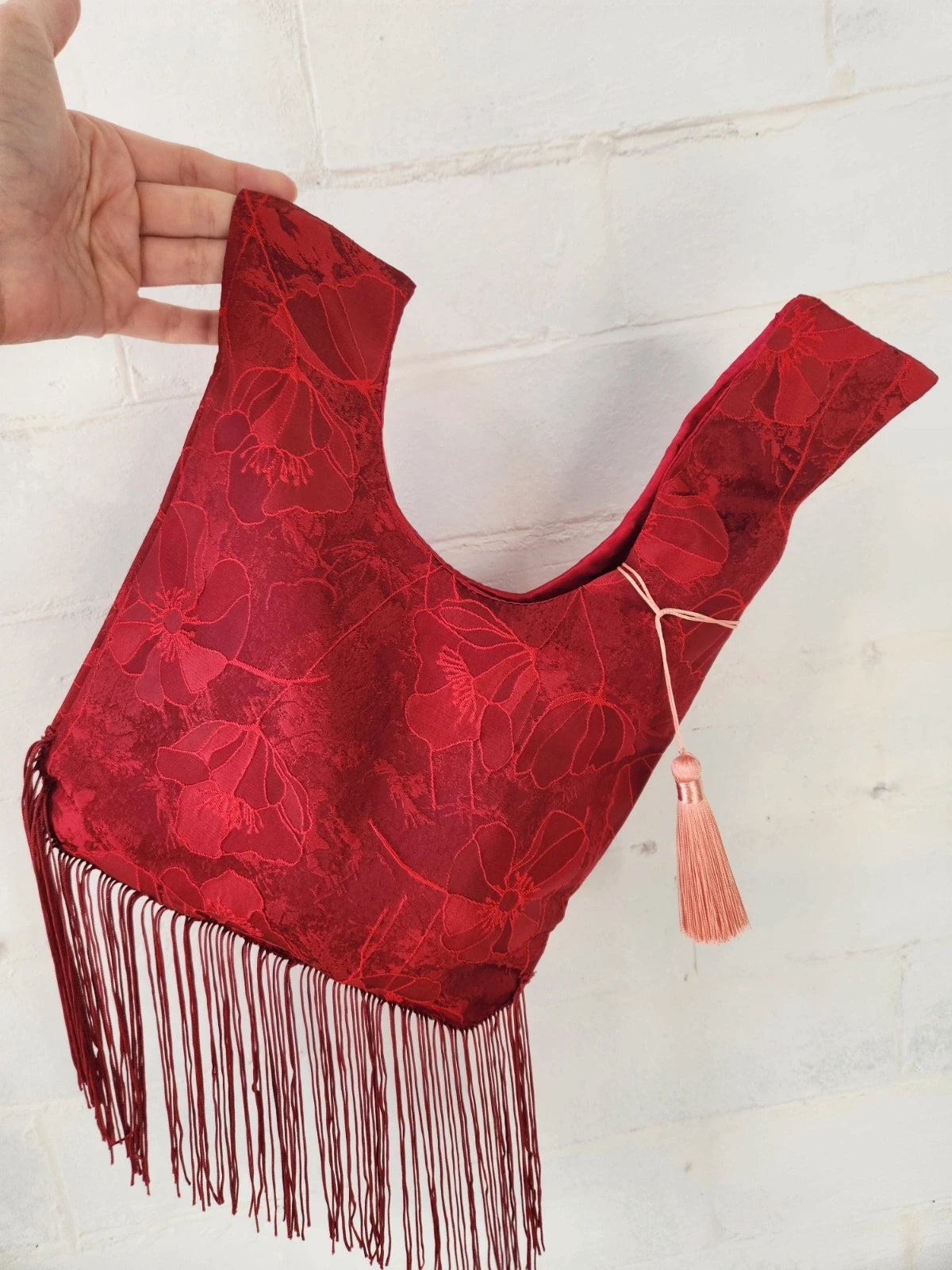 Japanese knot bag with a tassel fringe trim in red