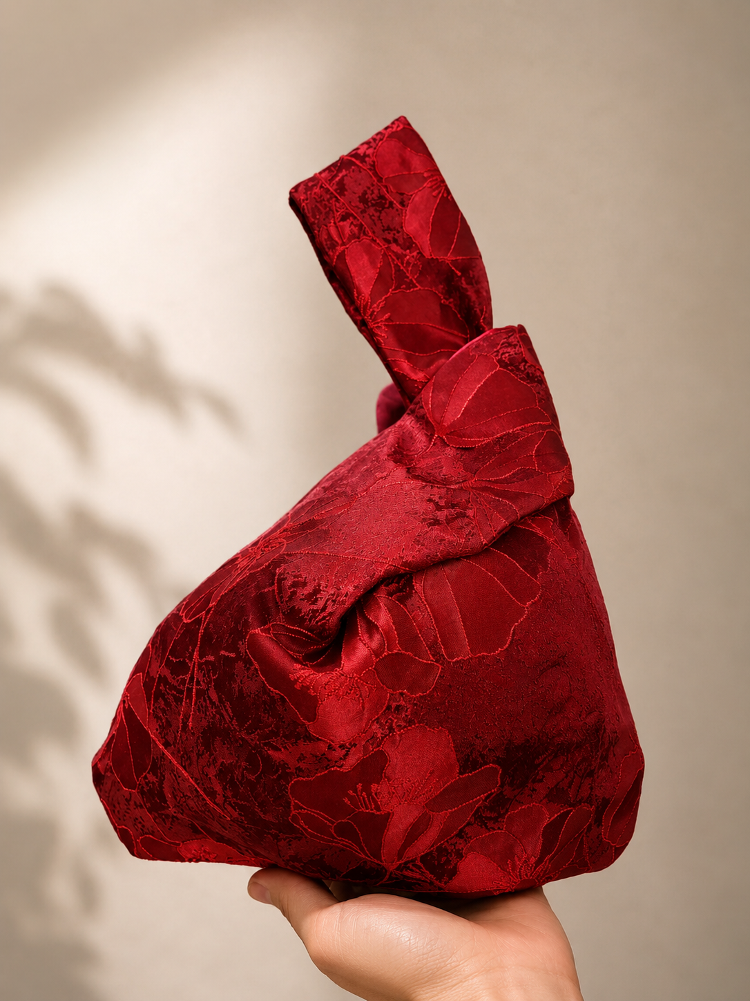 Japanese knot wrist bag with an orchid