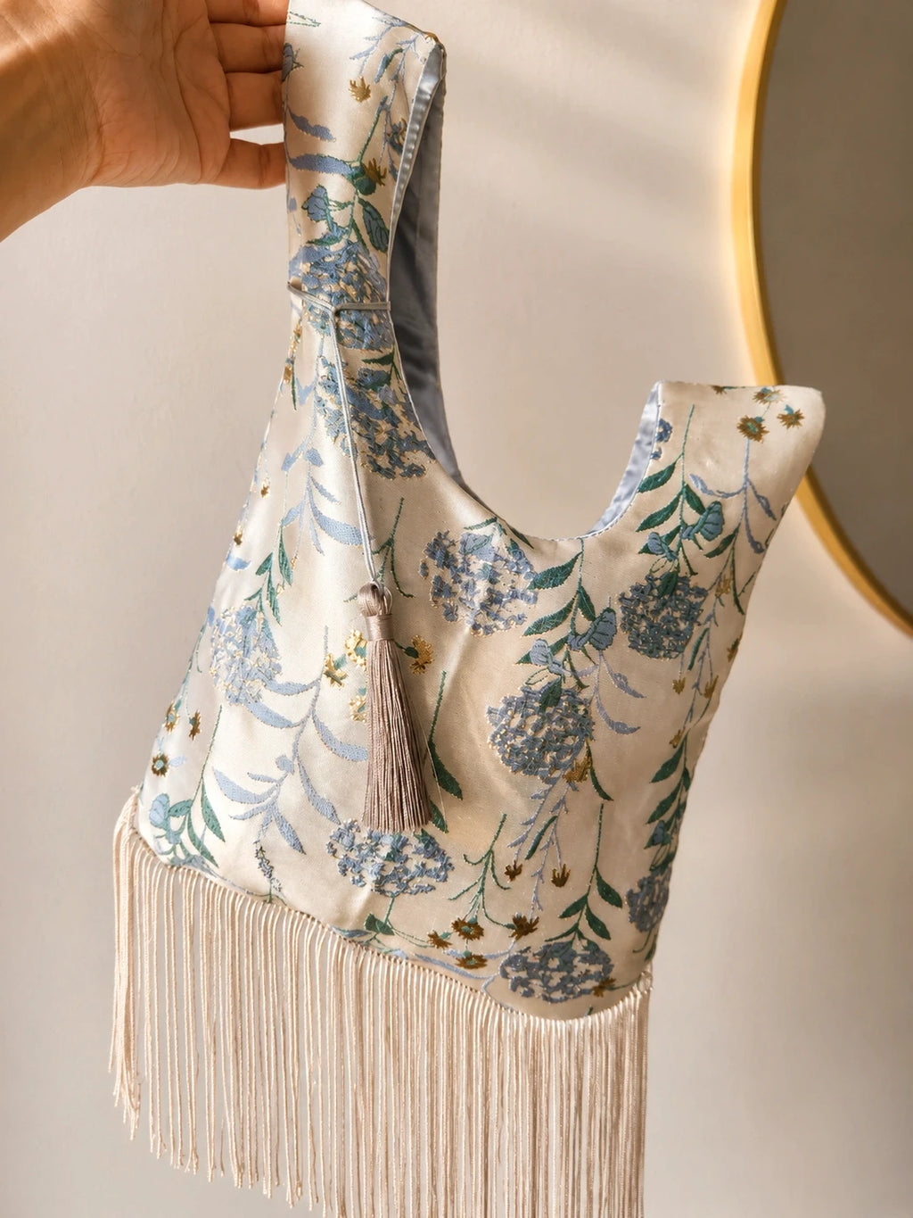 Japanese knot wrist bag with a tassel and a fringe trim