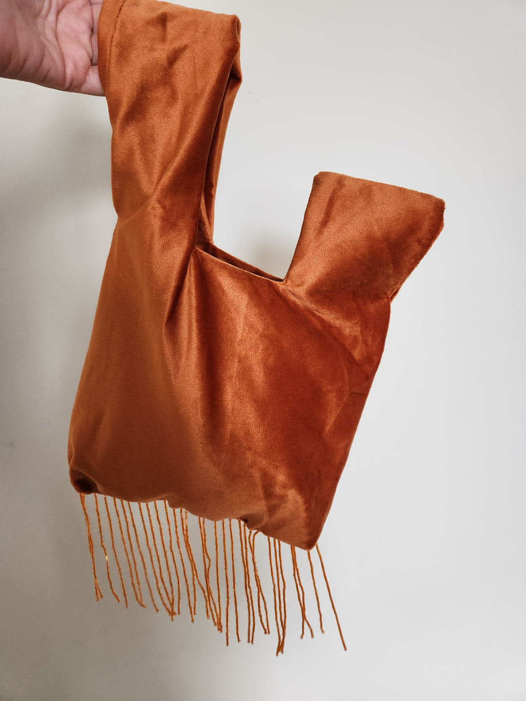 Japanese knot wrist bag with a beaded fringe trim
