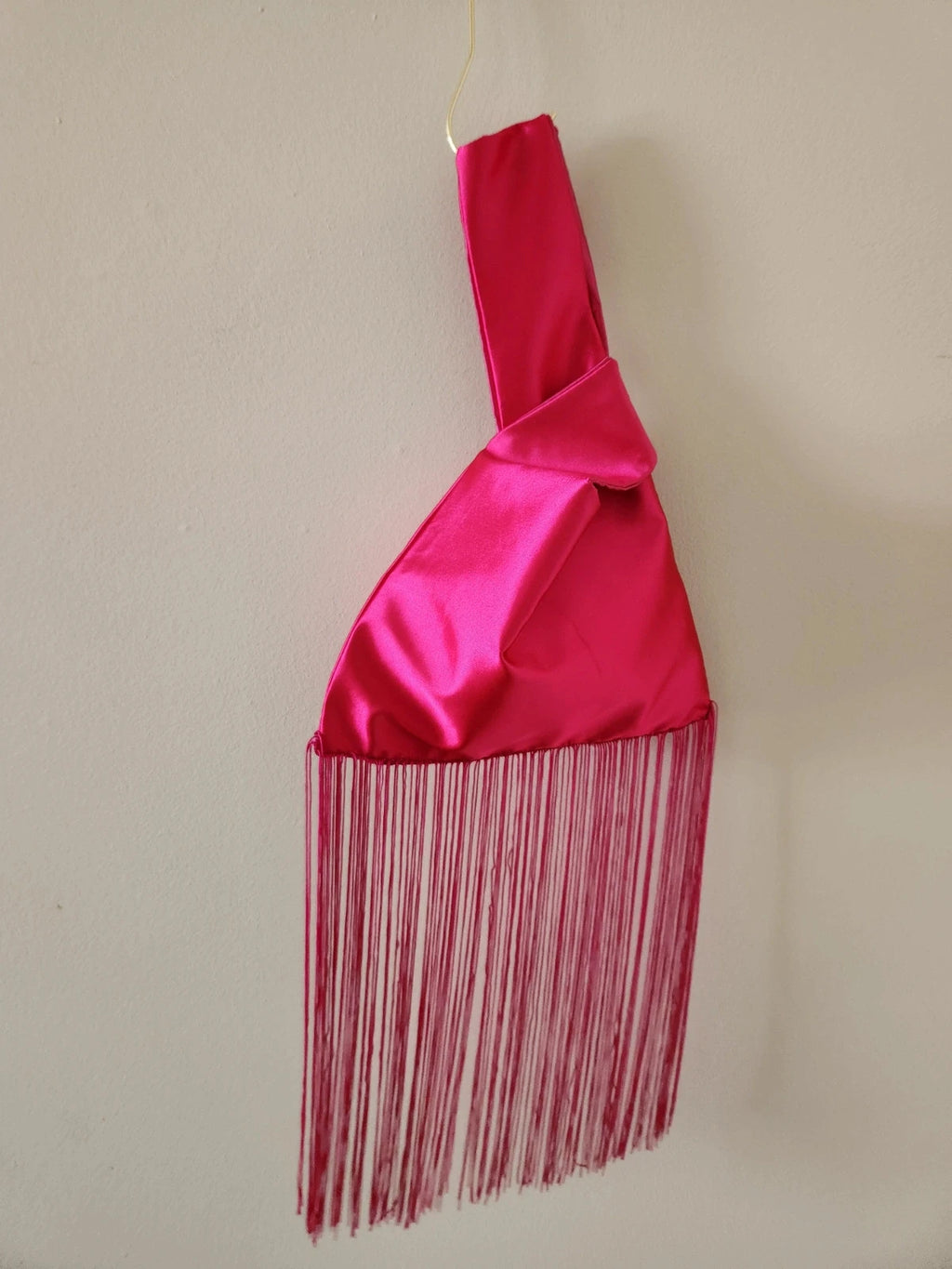 Japanese knot wrist bag in hot pink